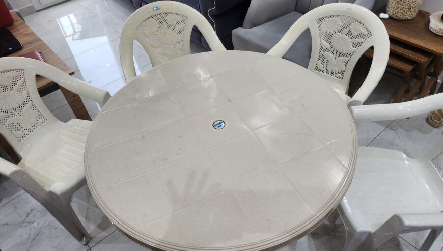 Plastic chairs with round table