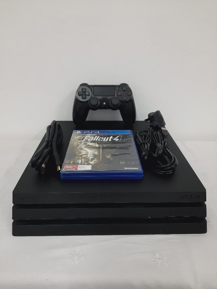 PS4 Pro 1TB Console with 1 Controller + CD Bundle