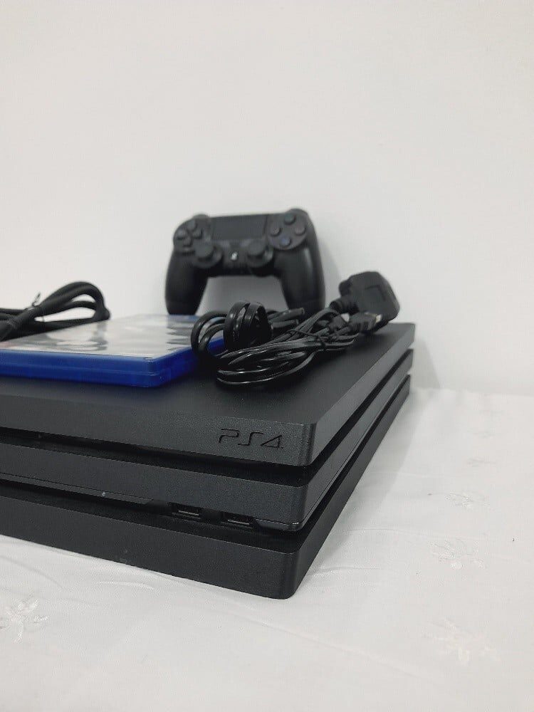 PS4 Pro 1TB Console with 1 Controller + CD Bundle