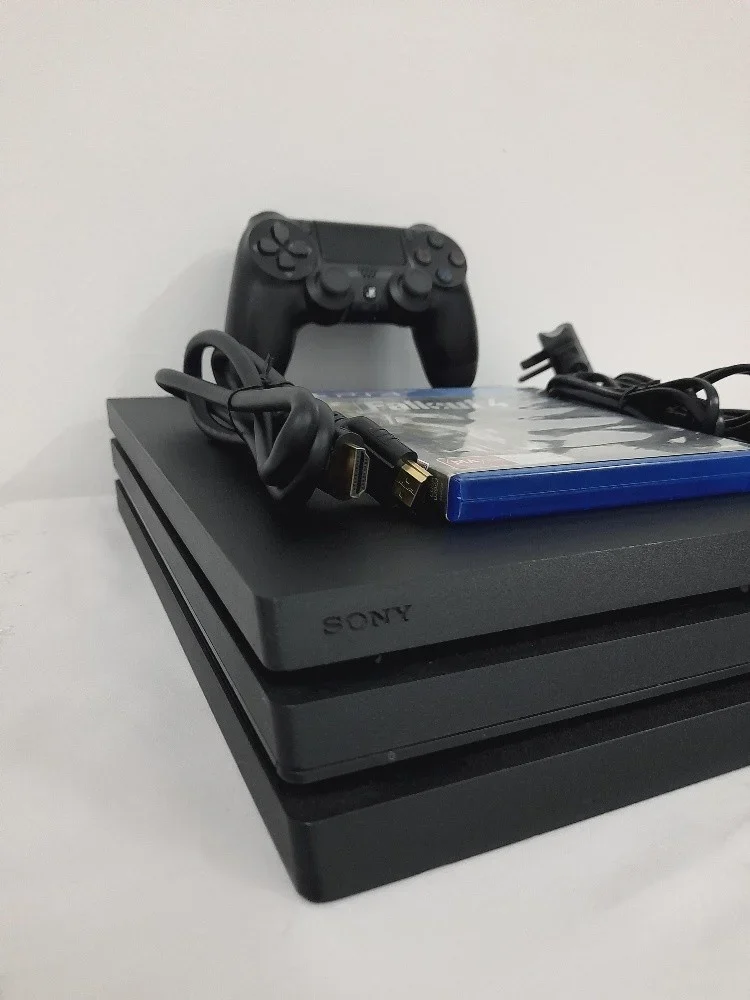 PS4 Pro 1TB Console with 1 Controller + CD Bundle